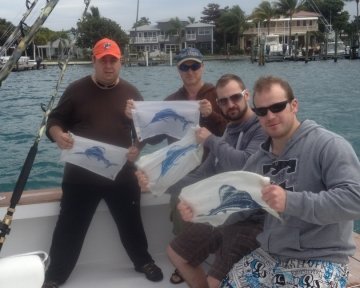 men holding up blue marlin logo